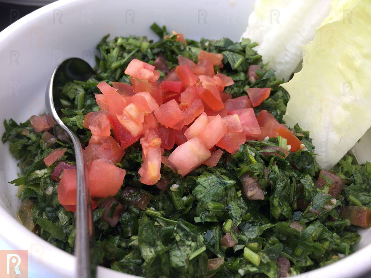 Tabbouleh topped with fresh tomatoes