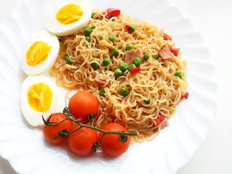 Noodles and mixed veggies, bacon and boiled eggs