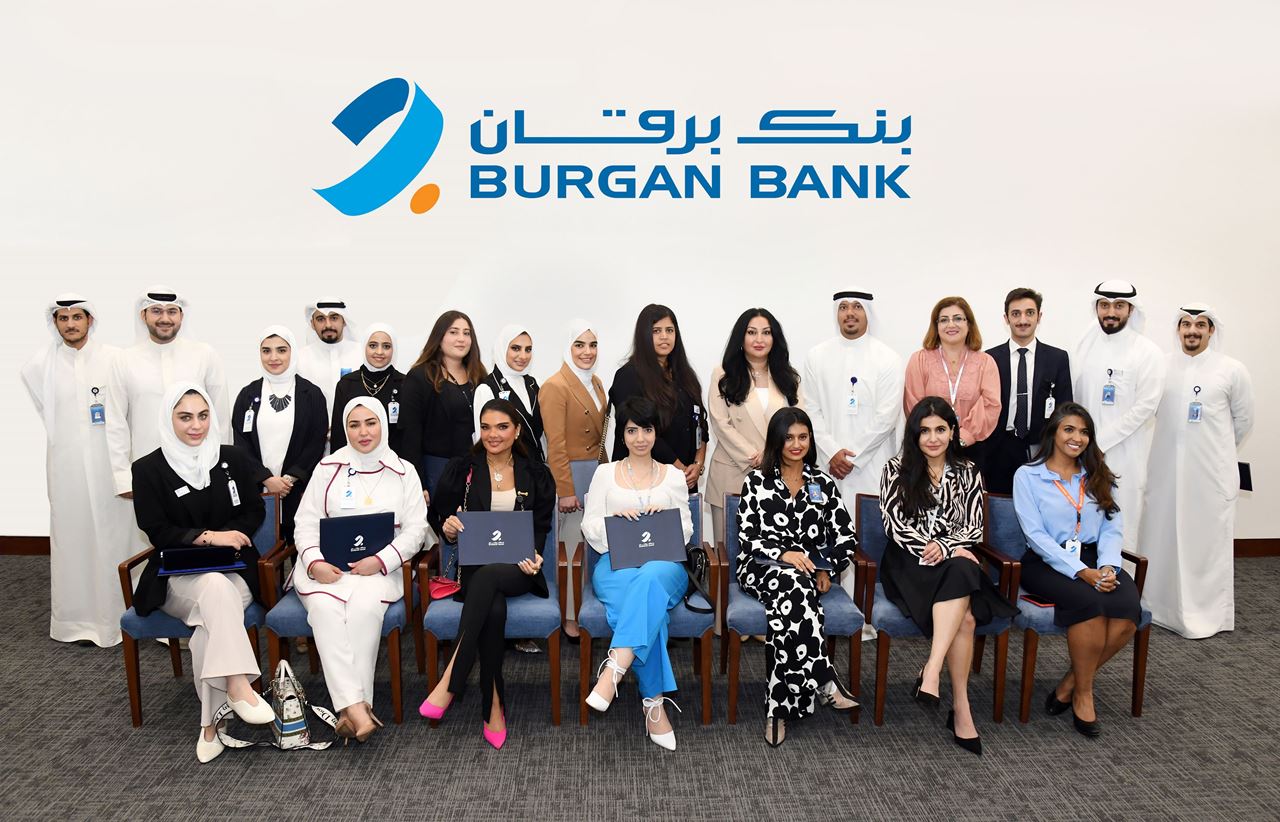 The Burgan Bank team with the academy graduates<br />