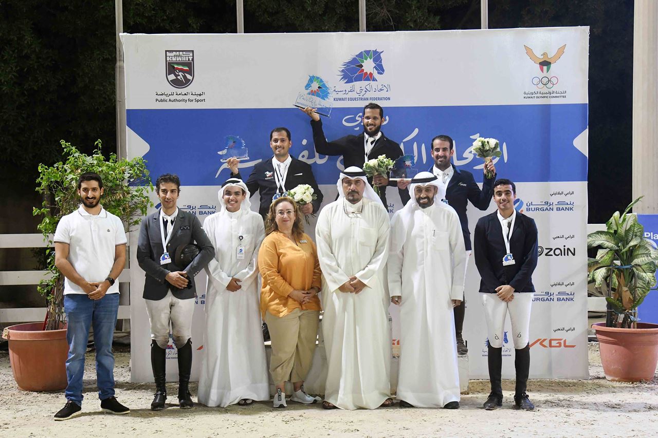 Mrs. Kholoud Rida AlFeeli, Group Head-Corporate Communications at Burgan Bank, and Mr. Talal AlAyar, Corporate & CSR Communications Officer at Burgan Bank, with the winners.