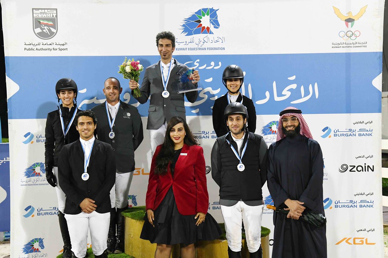 Ms. Hessa Al-Najadah, Senior Manager of Corporate and CSR Communications at Burgan Bank, with the winners.