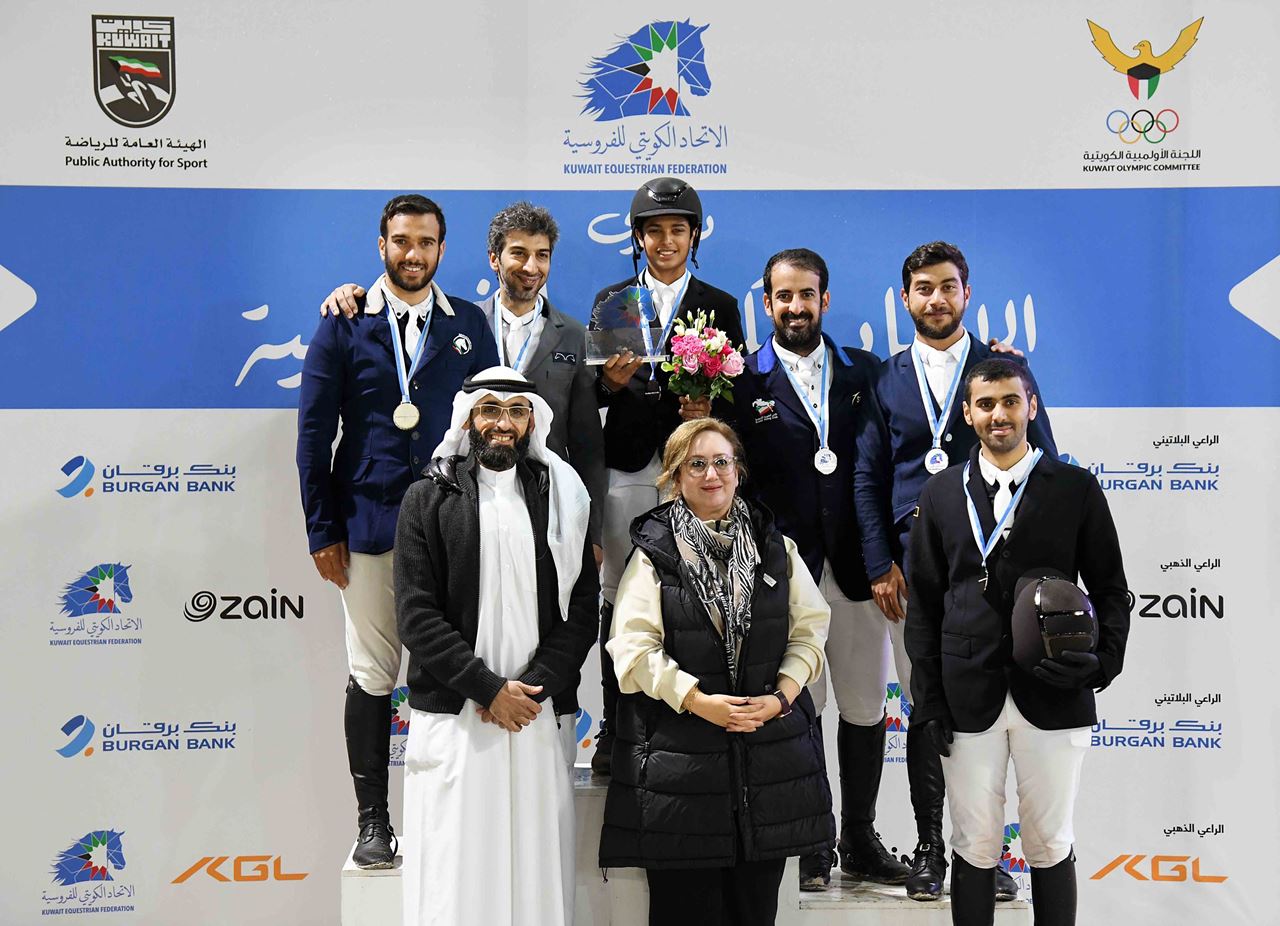 Mrs. Kholoud Redha Al-Feeli, Group Head - Marketing & Communications at Burgan Bank, with the winners